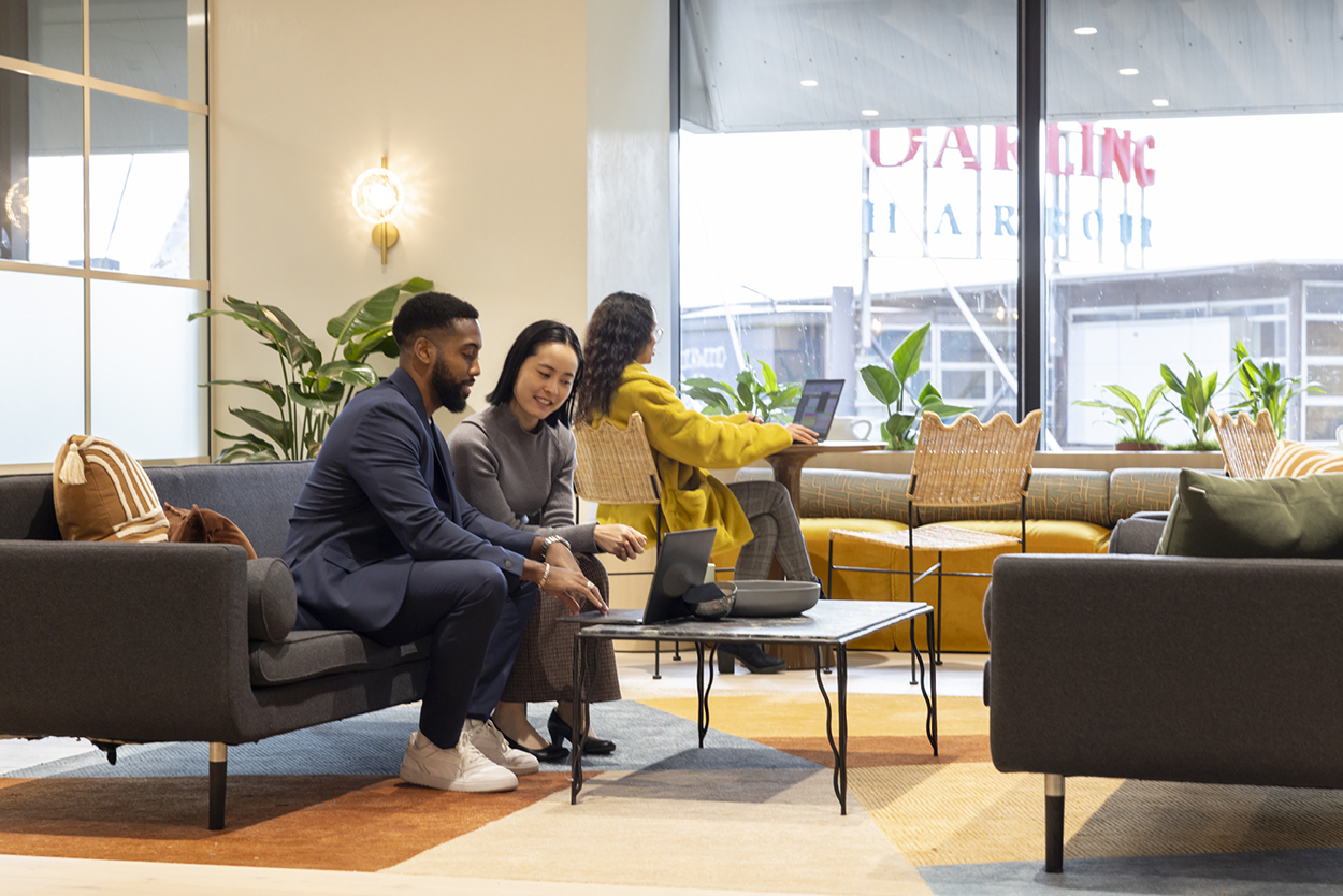 Members meeting on lounges at Space&Co Darling Park