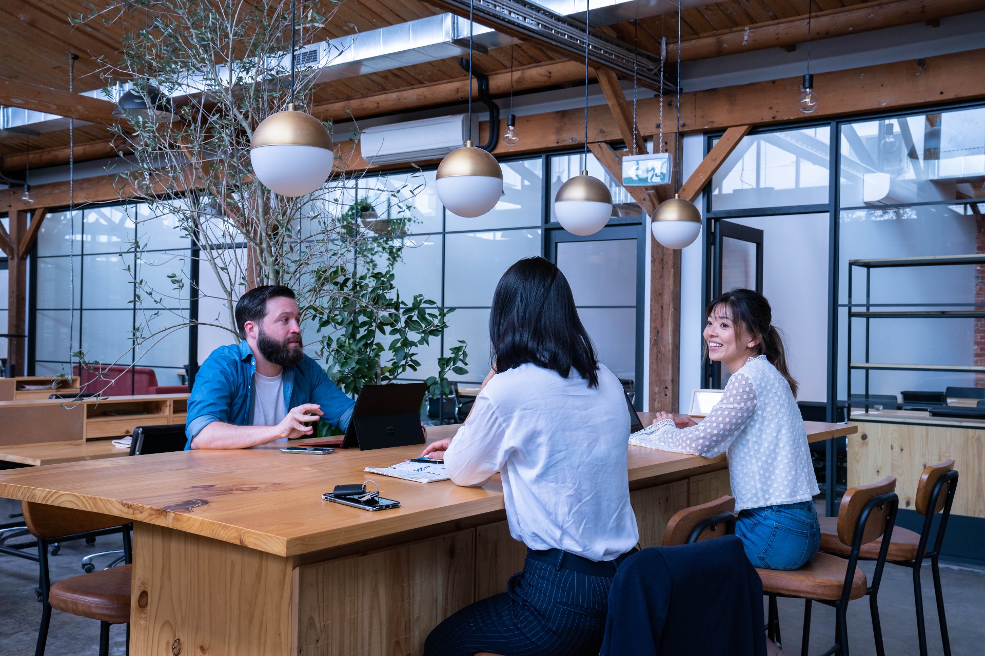 Community members chatting in a flexible workspace